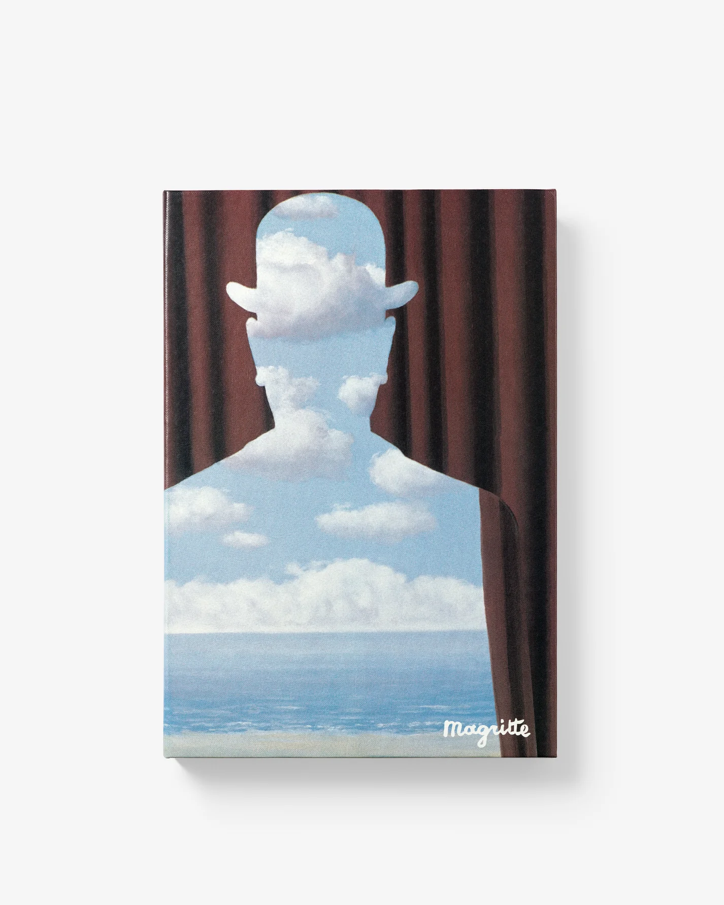 Livre design haut de gamme René Magritte sous étui par Assouline, disponible chez D-Style Interior.