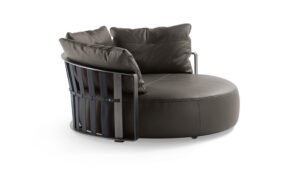 Canapé design haut de gamme Scarlett par Poltrona Frau, forme circulaire rotative avec structure acier et sangles cuir, disponible chez D-Style Interior