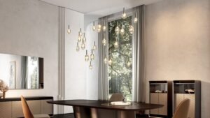 Lustre SASSI LAMPADARIO en verre de Murano transparent et doré avec éclairage LED intégré, design Reflex Angelo, disponible chez D-Style Interior