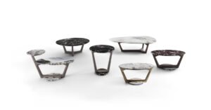 Savini table basse associe une base trapézoïdale en bois massif à un plateau en marbre assorti. Design sculptural et luxueux. Disponible chez D-Style Interior.