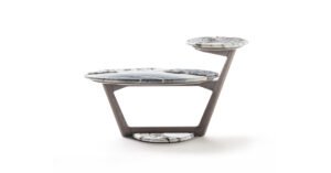 Savini table basse associe une base trapézoïdale en bois massif à un plateau en marbre assorti. Design sculptural et luxueux. Disponible chez D-Style Interior.